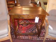 A Georgian oak side table fitted single drawer on turned supports