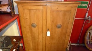 An old pine meat cabinet fitted pair of panelled doors enclosing shelves raised on turned feet