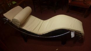 A Le Corbusier style chaise longue upholstered in cream leather