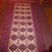 A fine North East Persian Zabir Belouch rug 230 cm x 110 cm repeating panel motifs on an ivory field