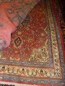 A fine North West Persian Sarouk rug 155 x 110 cm central floral pendant sapphire medallion on a