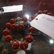 A ladies sponge coral necklace decorated with crystals and a pair of earings