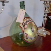 An antique green glass perfume bottle of large size