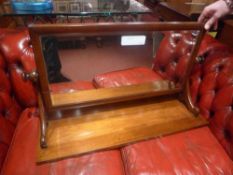 A Victorian mahogany swing frame dressing mirror with bevelled plate