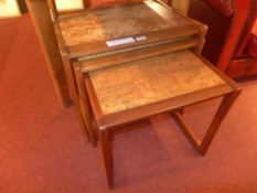 A G-Plan teak nest of three tables with formica style tops