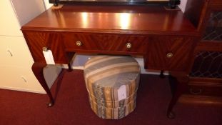 A Waring and Gillows mahogany writing table fitted three drawers on cabriole supports