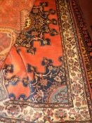A fine North West Persian Tafresh rug 203 cm x 133 cm central pole sapphire medallion on a rouge
