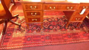 A fine North East Persian Meshad Belouch rug 245 cm x 120 cm bearing repeating motifs within