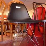 An Eiffel style designer chair raised on wire supports