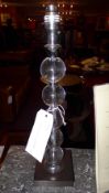 A pair of contemporary table lamps of glass globular form