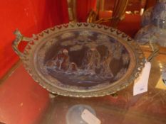 A C19th French gilt metal charger with extensive pierced detail and Oriental scene in relief