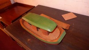 A painted wooden toy ark with animals