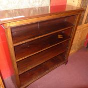 A C19th mahogany open bookcase with adjustable shelves on bracket feet