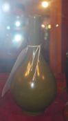 A Chinese tea dust glaze vase with a slender neck