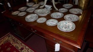 A mahogany pedestal partners desk the tooled leather lined top above arrangement of drawers to