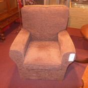 A pair of contemporary armchairs upholstered in brown mottled fabric