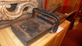 A late C19th cast iron office guillotine together with a similar printers press