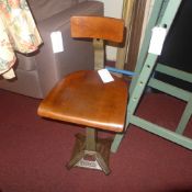 A Singer cast iron and plywood machinists stool