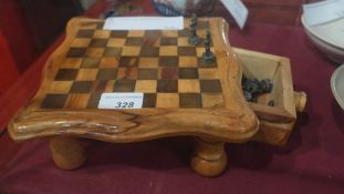 A chess set with metal playing pieces
