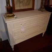 A French painted chest fitted three drawers raised on reeded supports