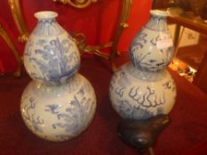 A pair of Chinese blue and white double gourd shaped vase decorated with dragons