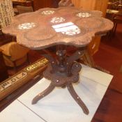 A C19th Indian carved hardwood and mother of pearl inlaid two tier occasional table on triform