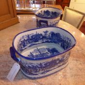 A pair of blue and white oval form Ironstone planters decorated with Chinese landscape pattern