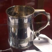 A silver plated tankard