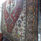 A fine North West Persian Heriz rug 200 cm x 140 cm stylised floral ivory medallions on a terracotta