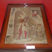 An antique needlework panel of a huntsman beside a cottage glazed and framed