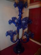 A blue glass epergne of seven branches