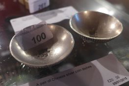 A pair of Chinese silver coin dishes