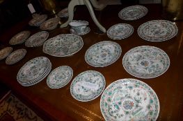 A Chinese famille vert porcelain export ware part dinner set including a sauce boat an oval