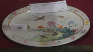 A Chinese Guang Xu oval form dish decorated with geese and foliage