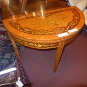 A Continental inlaid demi lune foldover tea table raised on square tapering supports