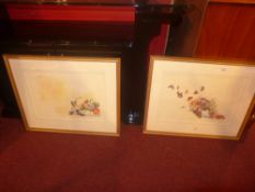 A pair of Limited Edition prints 71/ 100 signed indistinctly one of a picnic hamper the other a