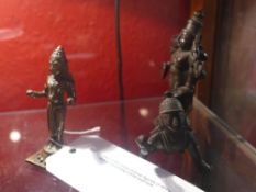 Two C19th Indian bronze figures of deities and a similar crouching C20th example
