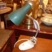 A 1950`s German desk lamp with green shade on adjustable supports