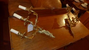 A pair of gilt metal twin branch wall sc