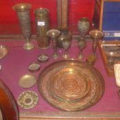 A collection of engraved brass items and