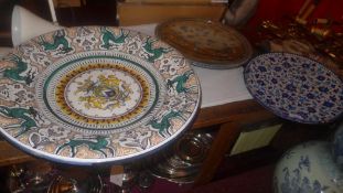 Three eastern porcelain chargers of larg
