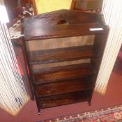An oak open bookcase with pierced detail