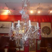 A cut glass hanging chandelier of eight