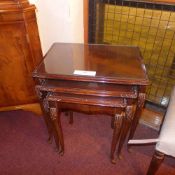 A French mahogany nest of three low tabl