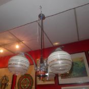 An Art Deco chrome hanging light with th