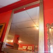 A contemporary wall mirror the rectangul