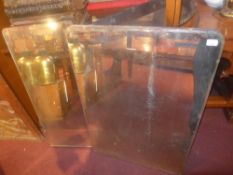 Three unframed mirrors of different desi