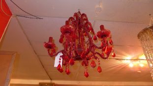 A rouge glass beaded hanging chandelier