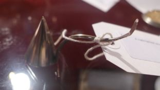 A hallmarked silver candle snuffer
