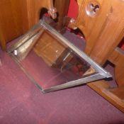 An Art Deco diamond form wall mirror wit